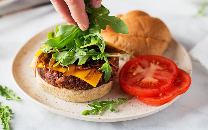 Plant-Based Arugula and Caramelized Onion Burger